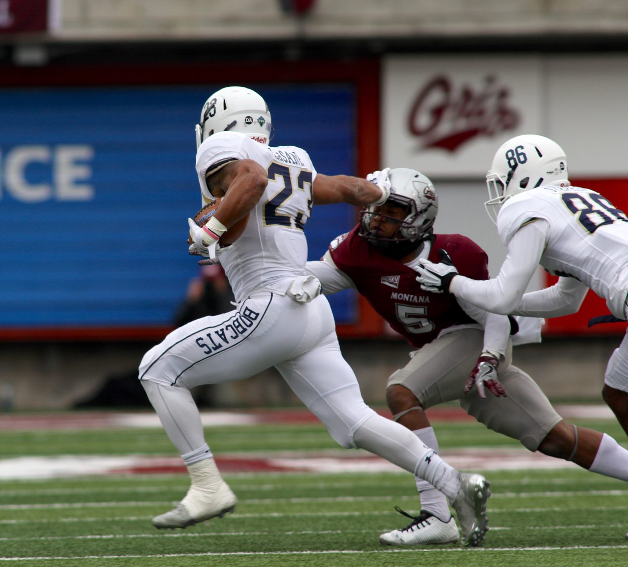 MSU running back Nick LaSane (23) stiff arms Montana safety Justin Strong (5) in 2016 