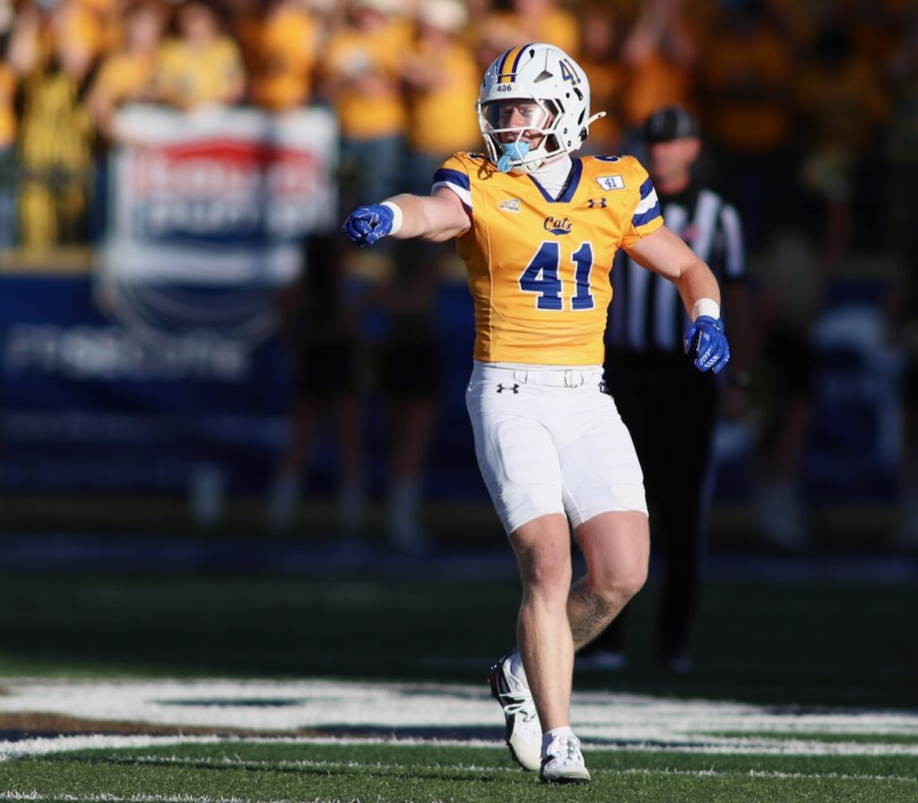 Montana State safety Caden Dowler points and makes a call