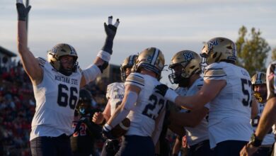 Adam Jones celebrates a touchdown with Titan Fleischmann and the Bobcat linemen