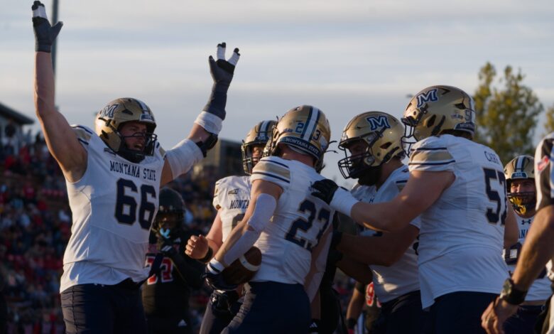 Adam Jones celebrates a touchdown with Titan Fleischmann and the Bobcat linemen