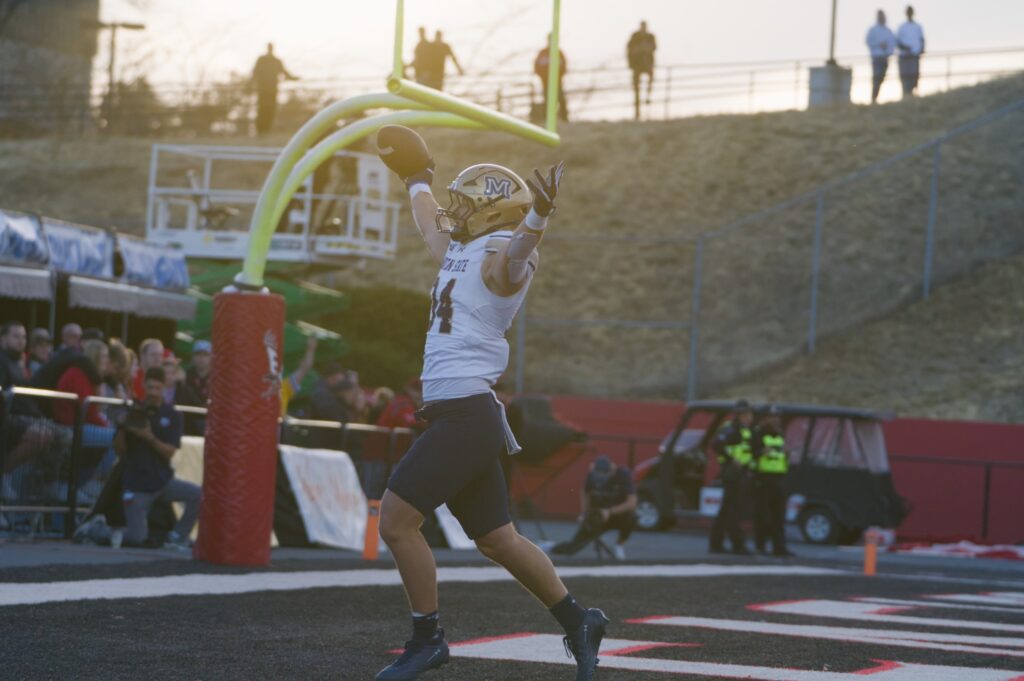 Cole Taylor celebrates his pick-six under the goalpost