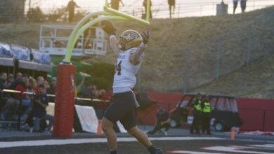 Cole Taylor celebrates his pick-six under the goalpost