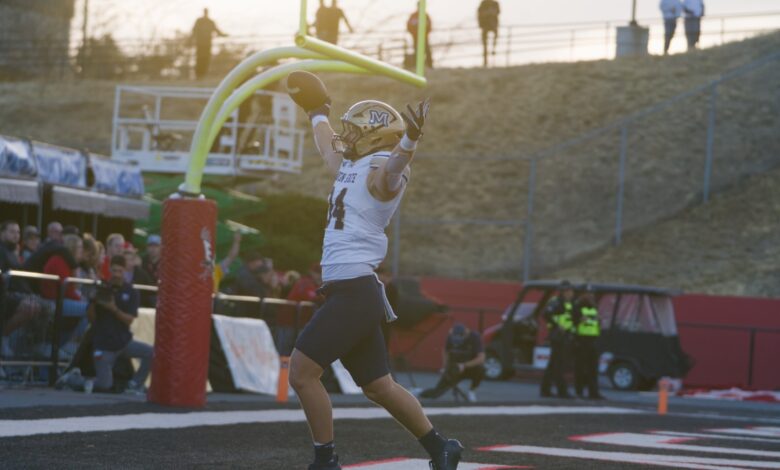 Cole Taylor celebrates his pick-six under the goalpost