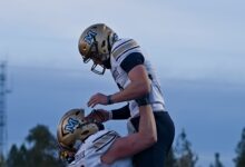 Justin Lamson lifted by Fleischmann after a touchdown