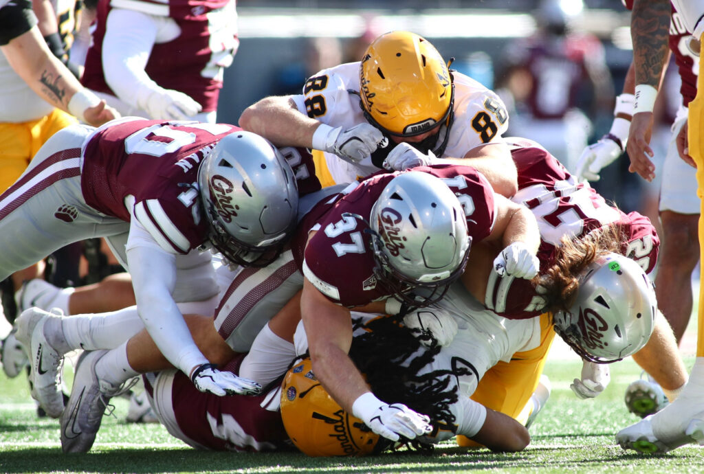 Clay Oven and Griz defense gang tackle