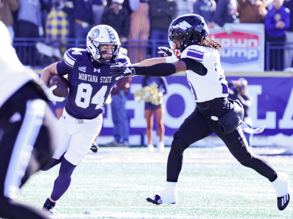 Dane Steel fends off a Weber State defender