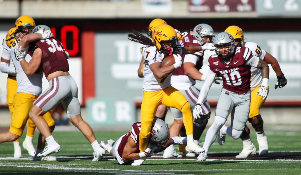 Eli Gillman runs in traffic