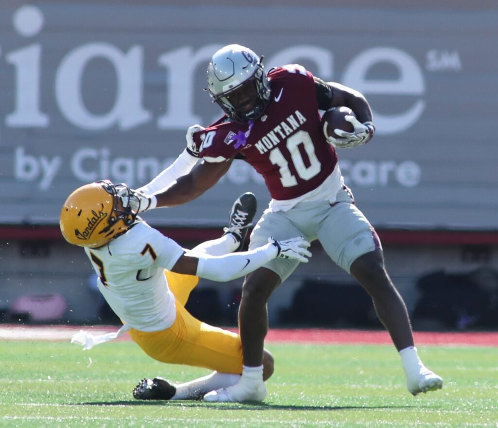 Eli Gillman runs through Aaron Kinsey