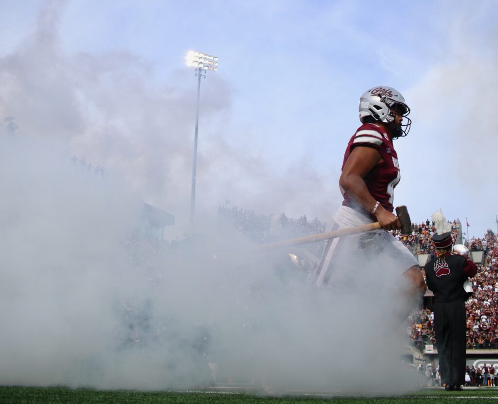 Griz player runs out through the smoke