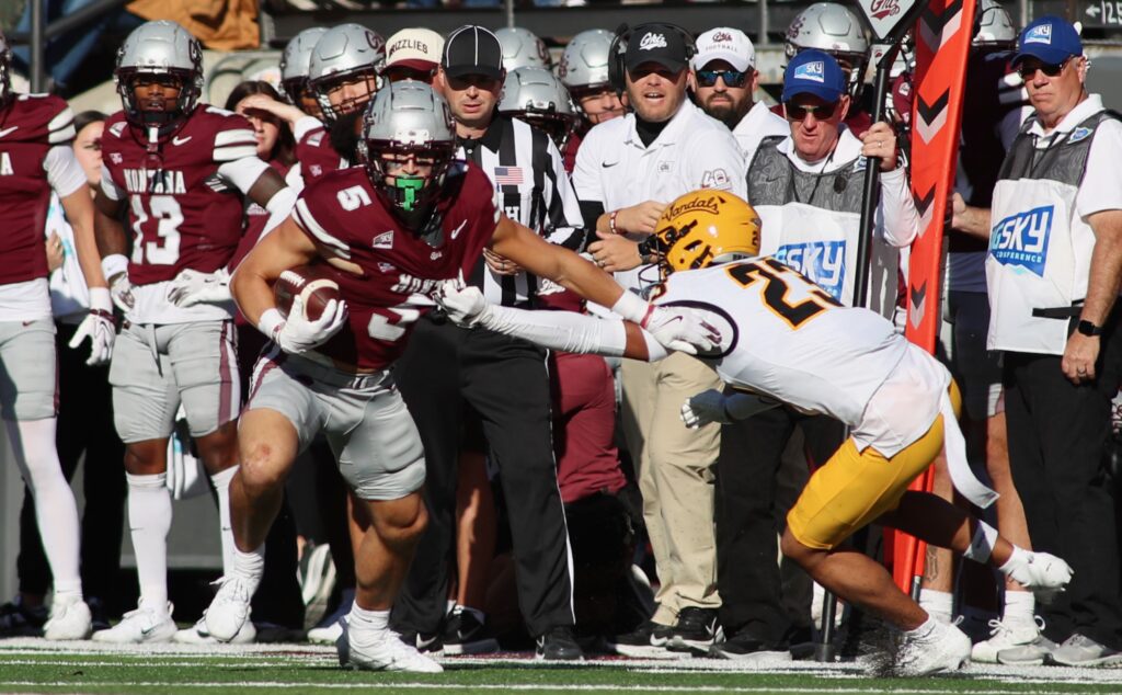 Ian Finch breaks a tackle on the sideline