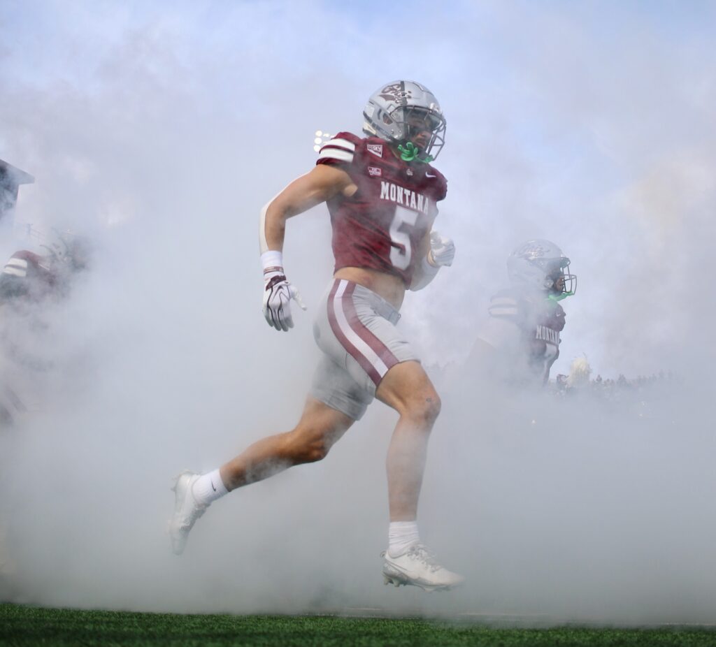 Ian Finch runs out through the smoke