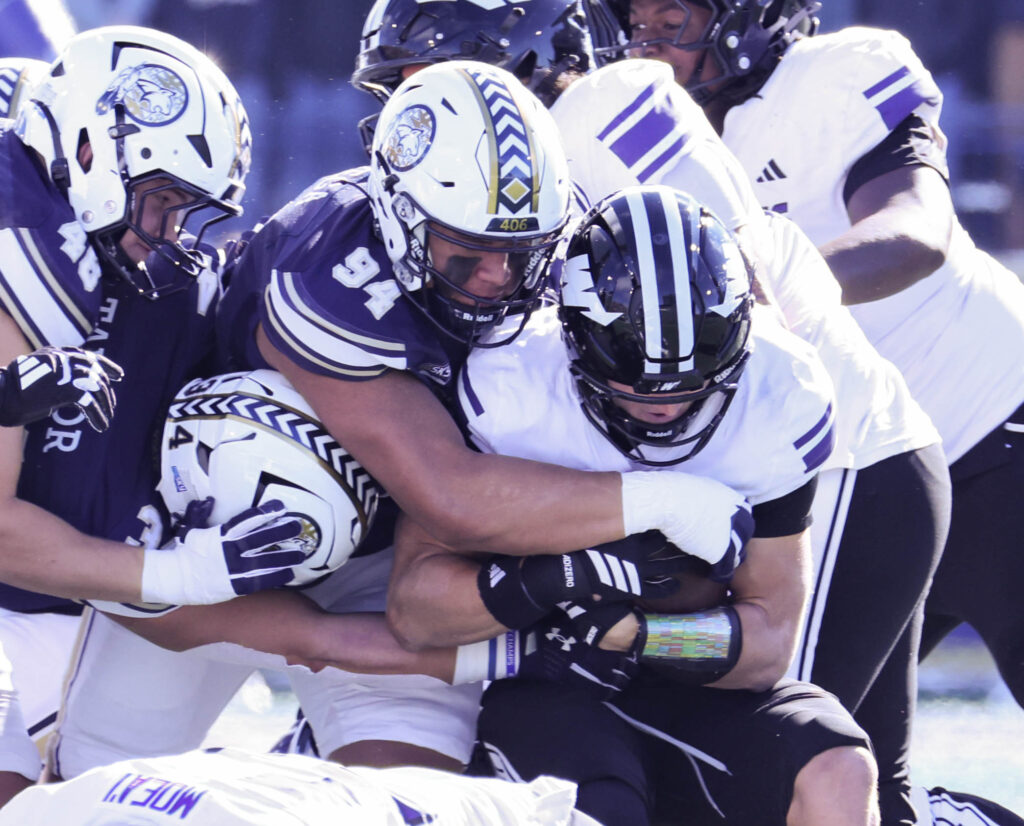 Josiah Asuega makes a tackle in the trenches