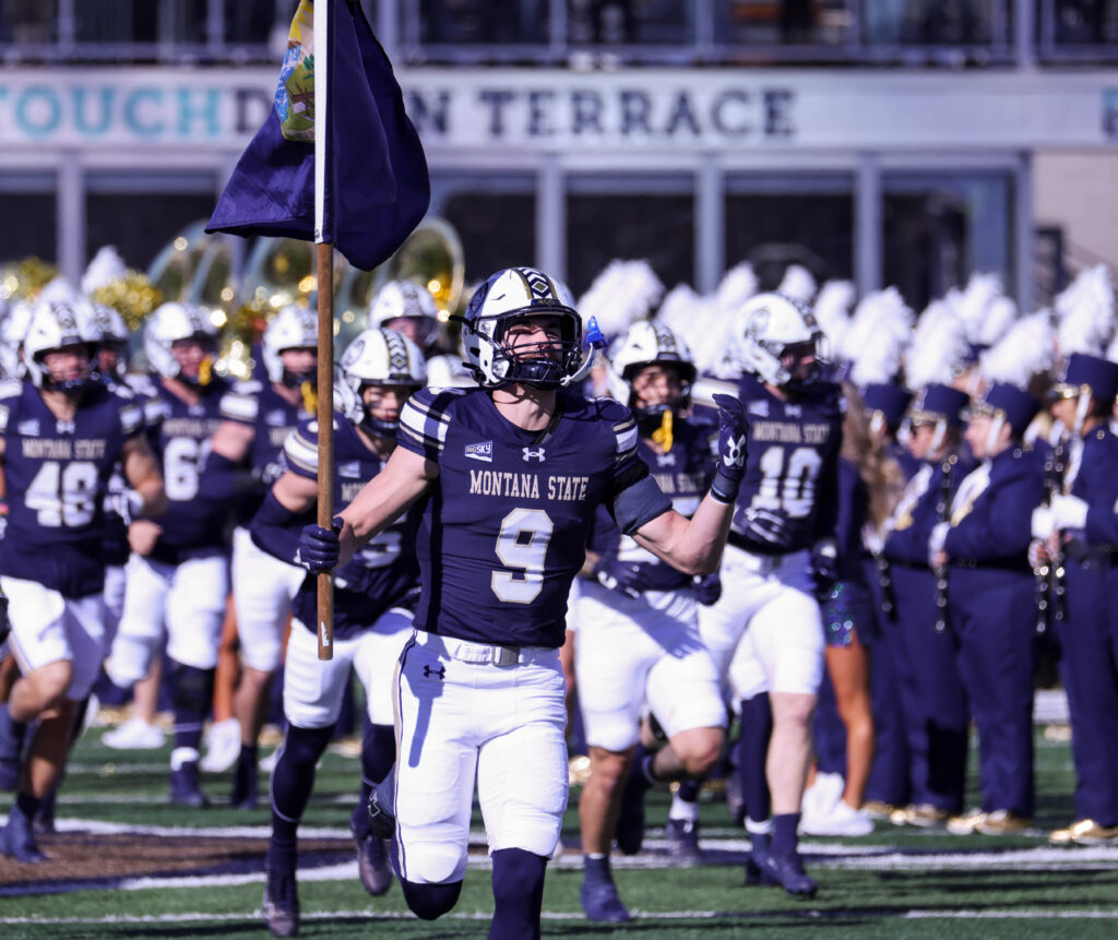 Mason Dethman leads the Bobcats onto the field