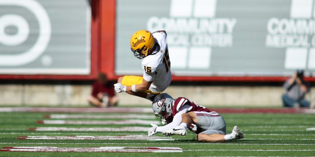 Superales leaps over Griz tackler