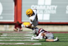 Superales leaps over Griz tackler