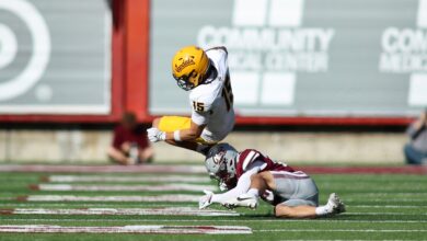 Superales leaps over Griz tackler