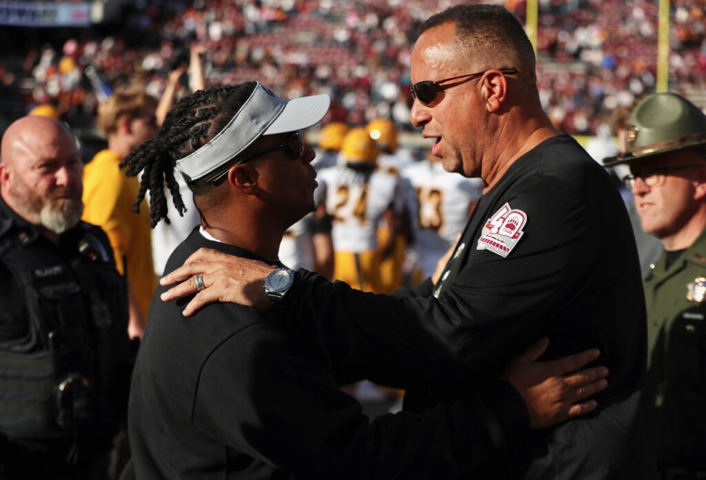 Thomas Ford Jr. and Bobby Kennedy meet before kickoff