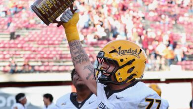 Vandals lineman hoists the Little Brown Stein