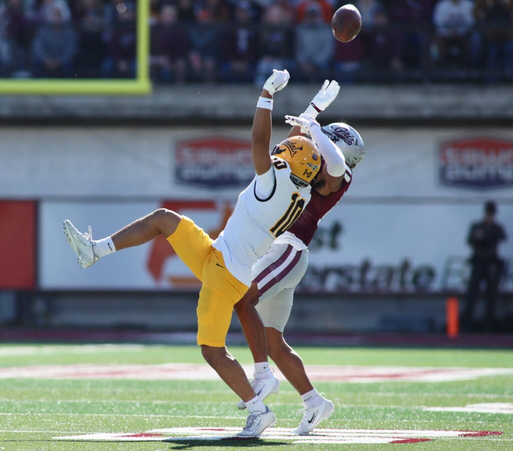 Vandals receiver and Griz defender battle for the ball