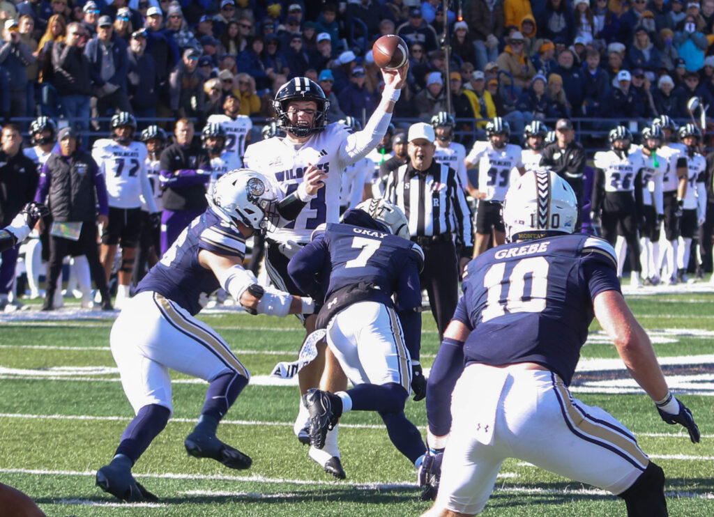 Weber State quarterback Nate Dahle throws over the Montana State rush