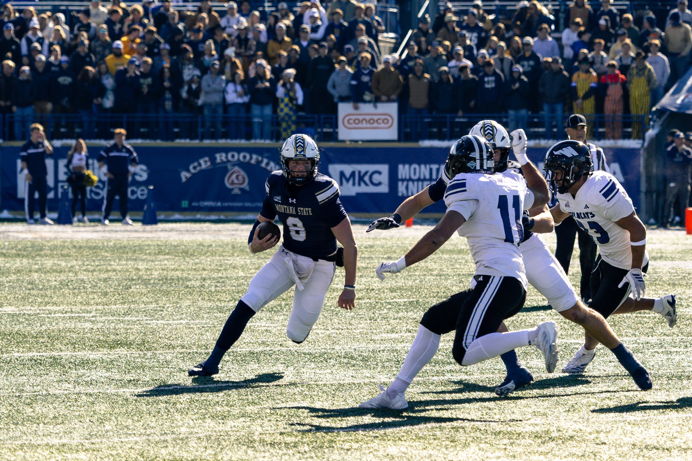 Justin Lamson scrambles past the Weber State defense