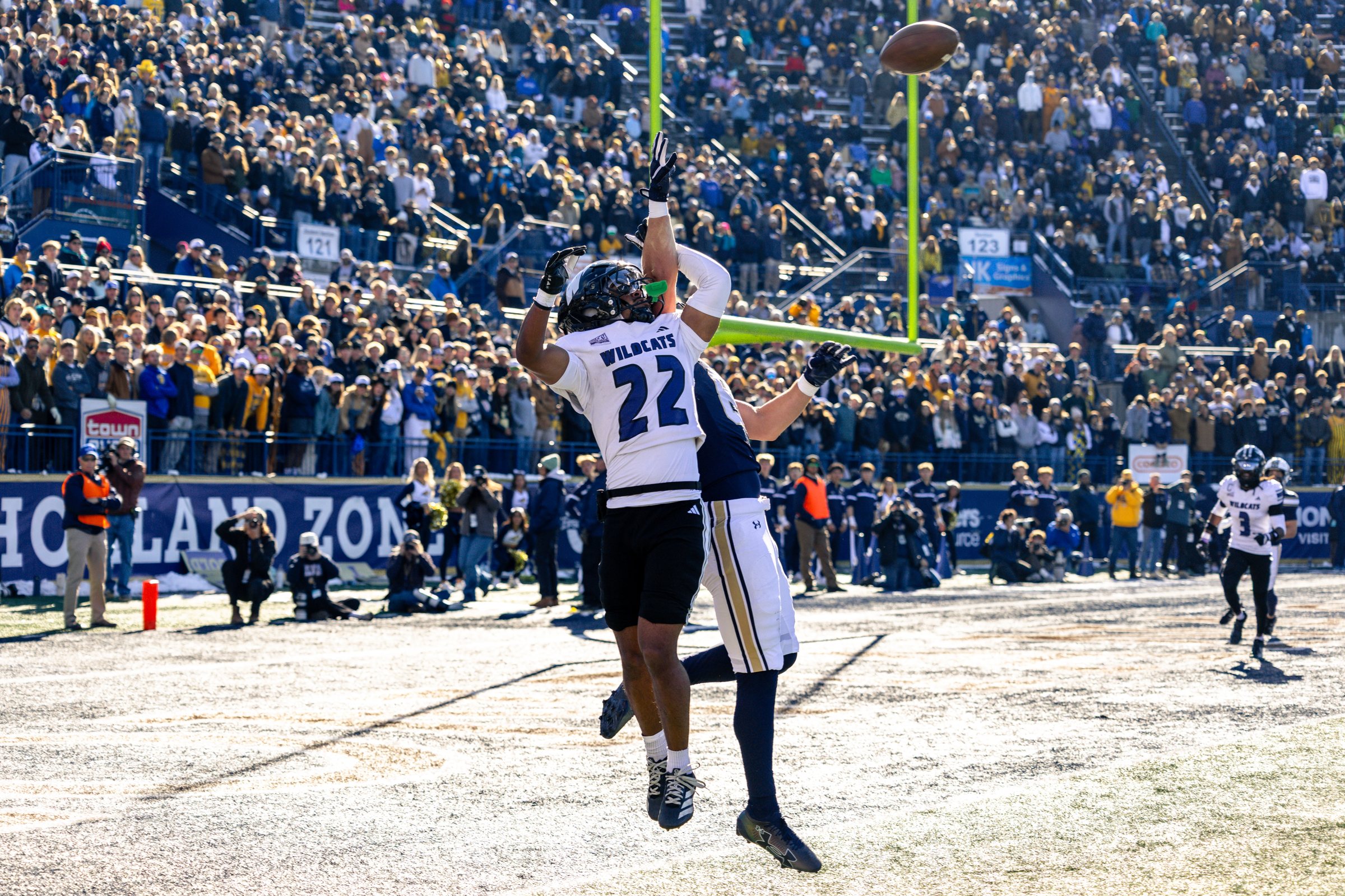 A Bobcat receiver battles a Weber State defender for a jump ball