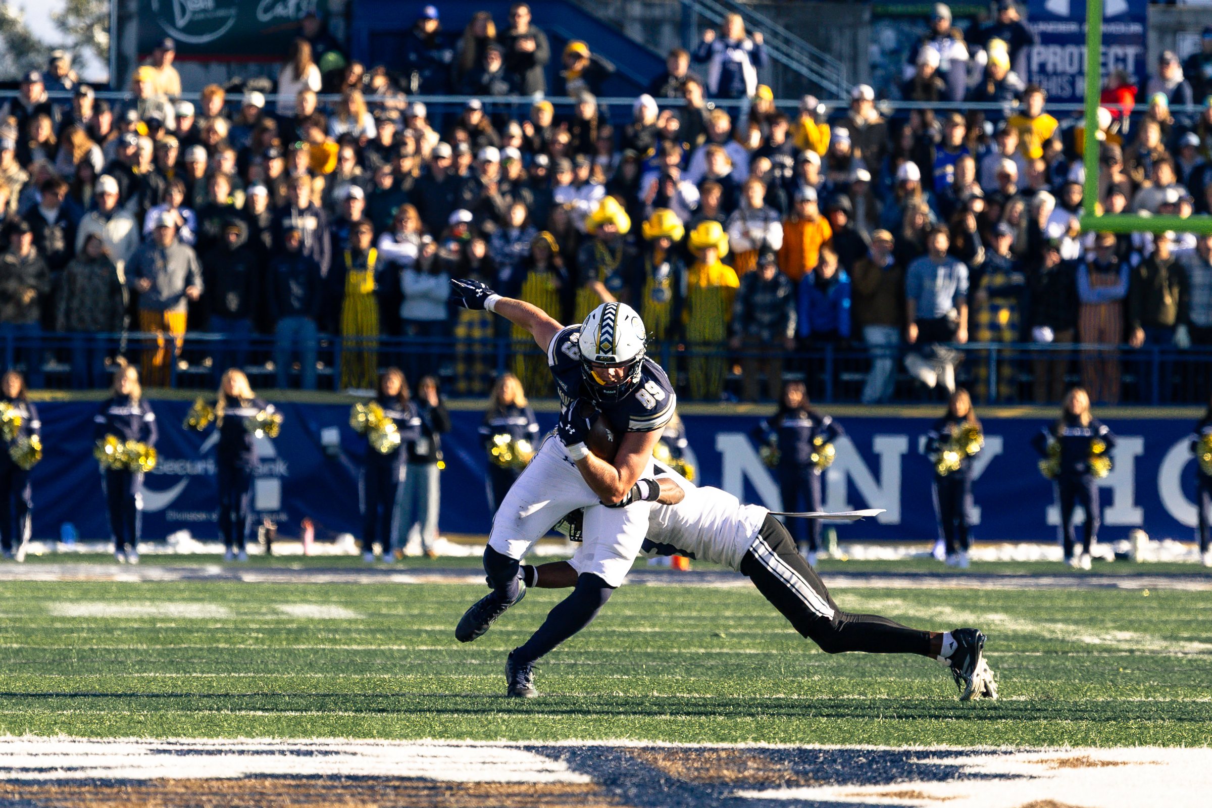 A Bobcat tight end fights through a tackle