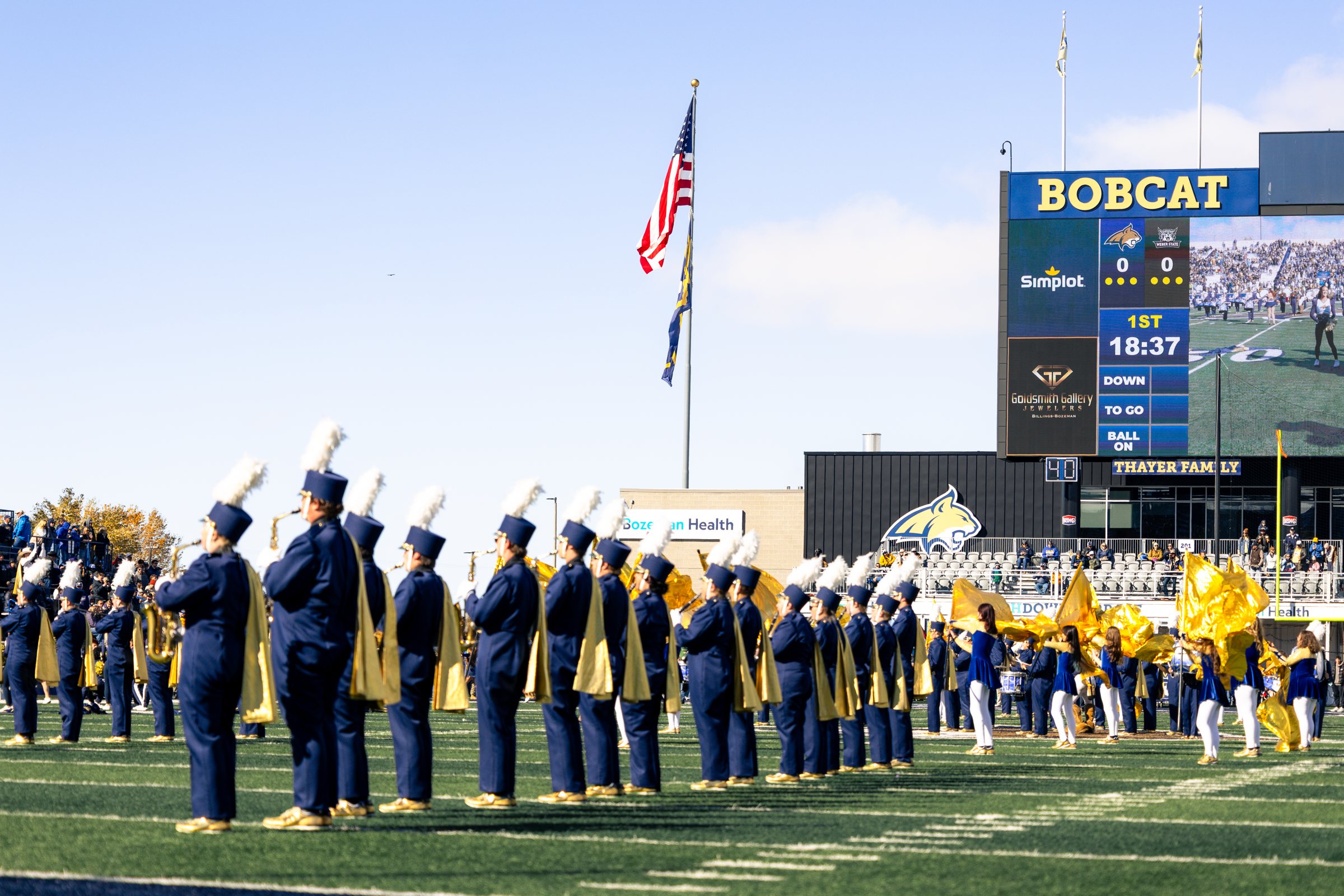 The Spirit of the West marching band lines the field before kickoff