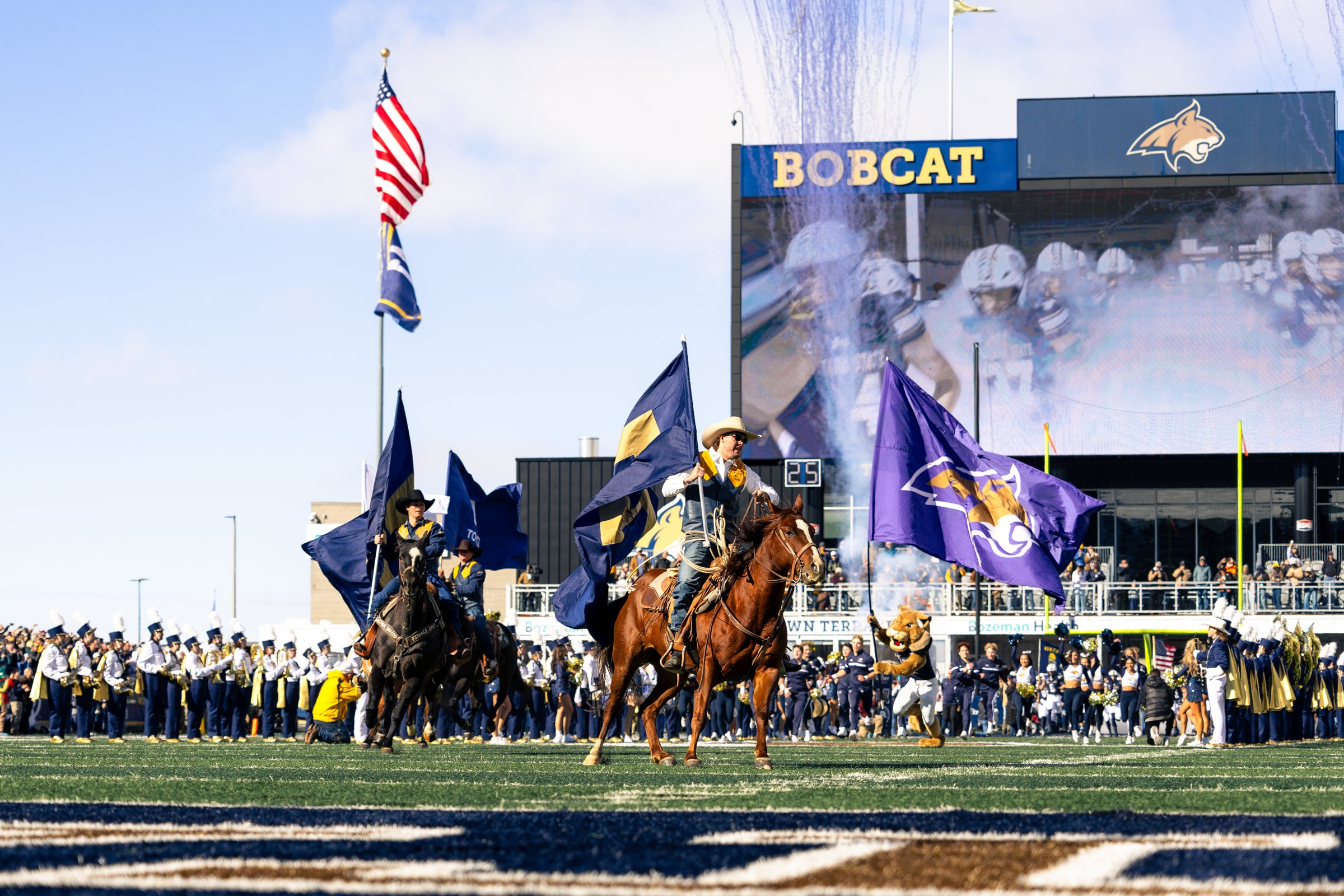 Bobcat riders lead the pregame flag run